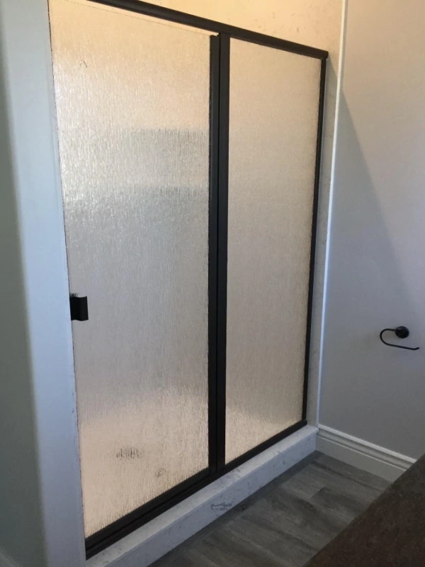 Eight example of a semi-frameless shower door.